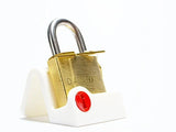 The DanLock by Dan Feldman on a white display stand, a legendary puzzle lock designed by Dan Feldman in 1996.