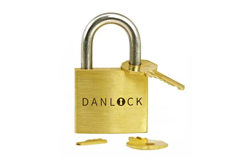 Close-up shot of the engraved DanLock puzzle lock. Highly praised by authorities like Chris Ramsay, this complex interactive piece is perfect for family game nights, coffee table gatherings, or office desk entertainment.
