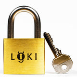 Front view of the Loki puzzle lock alongside its key components, built for people who say they don't want anything but enjoy a hard logic puzzle.