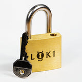 The Loki puzzle lock showing the key entering the keyhole mechanism, the first step in a multi-stage sequential discovery puzzle.
