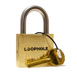 Close-up of the LoopHole trick lock showing the engraved Puzzlocks logo on its brass padlock housing.