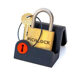 The PicoLock by Boaz Feldman resting on a black display stand, a compact puzzle that's easy to keep on a desk between solves.