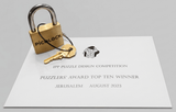 PicoLock brass puzzle lock with its Puzzlers' Award Top Ten Winner certificate, Nob Yoshigahara Puzzle Design Competition, IPP Jerusalem, August 2023.